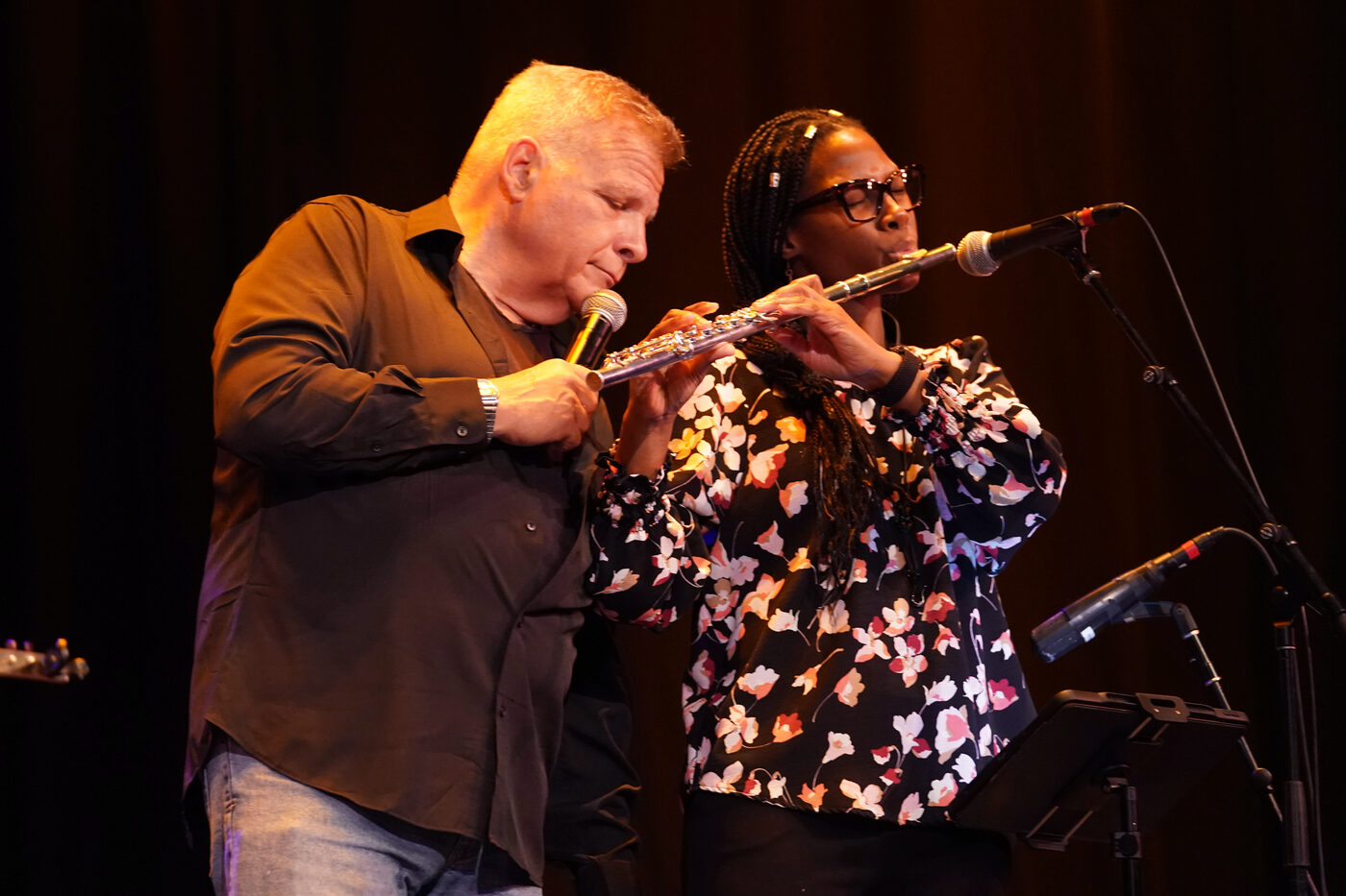 Jim DeRosa singing alongside Meredith Foreman on flute